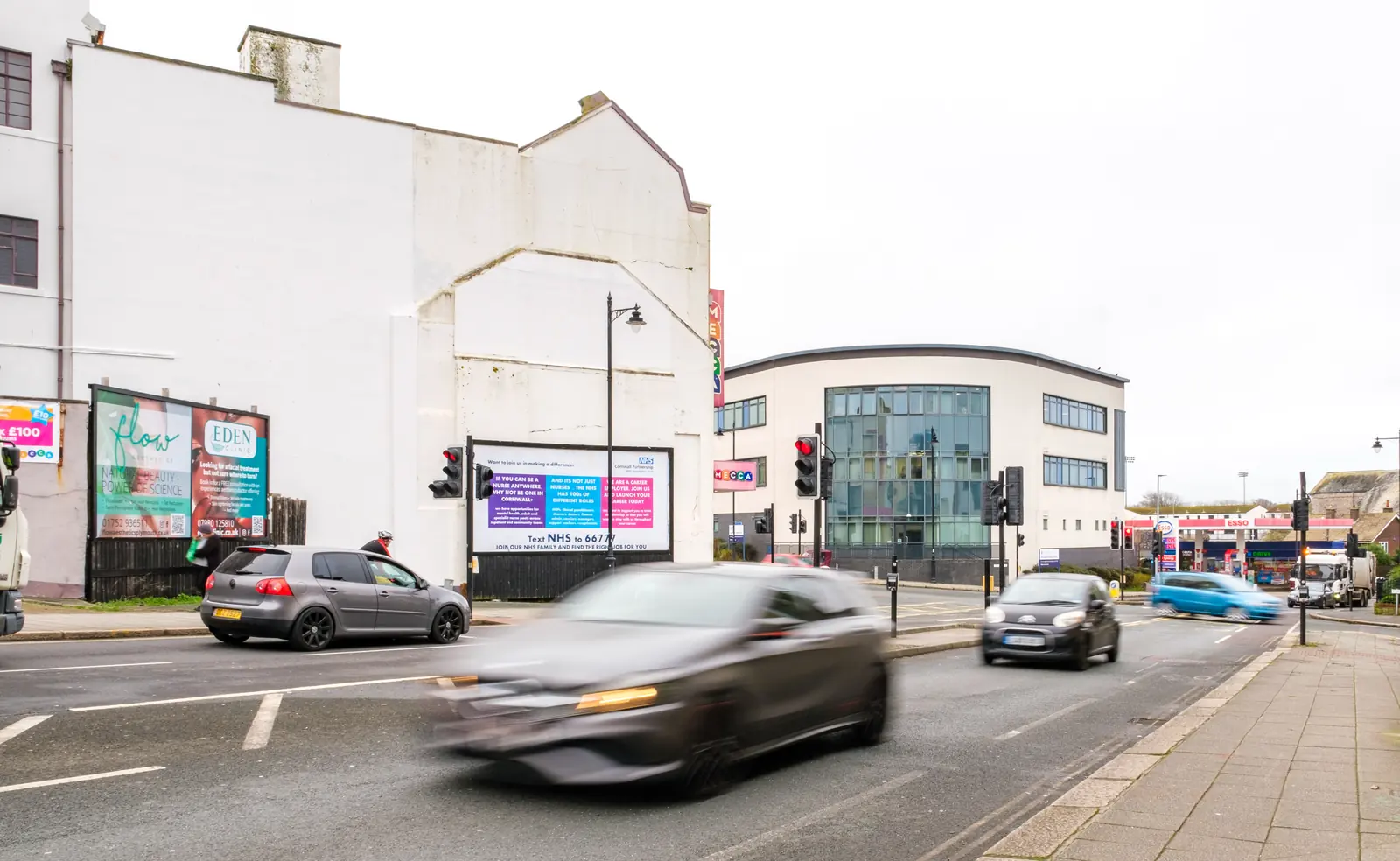 Fore Street billboards in Devonport, Plymouth, seen from further up the road