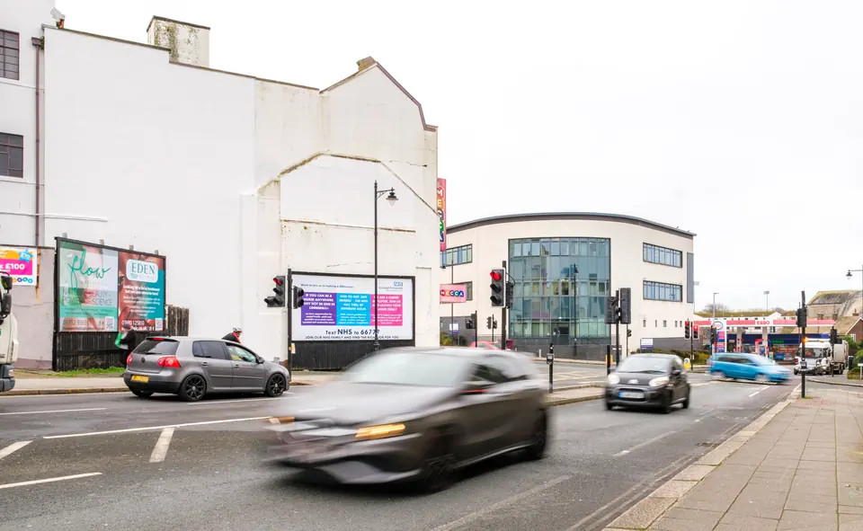 Fore Street billboards in Devonport, Plymouth, seen from further up the road