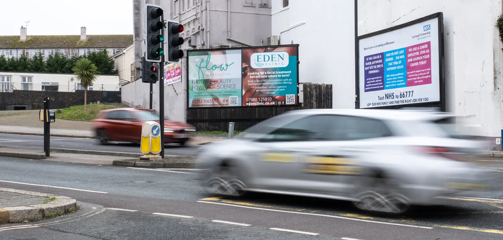A car speeding past the Fore Street billboards in Plymouth