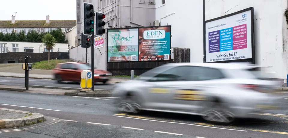 A car speeding past the Fore Street billboards in Plymouth