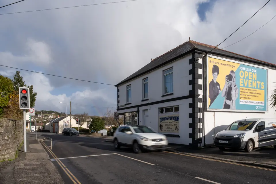 Traffic stopped at the lights beside the Tregonissey Road billboard in St Austell